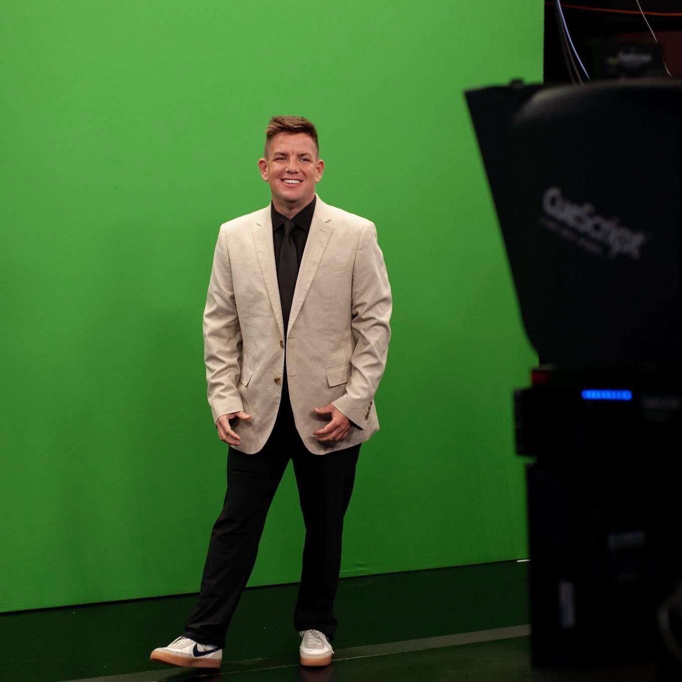 Meteorologist Scotty Powell in front of a studio green screen